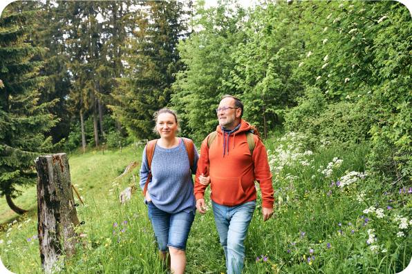 Man and woman hiking in the woods